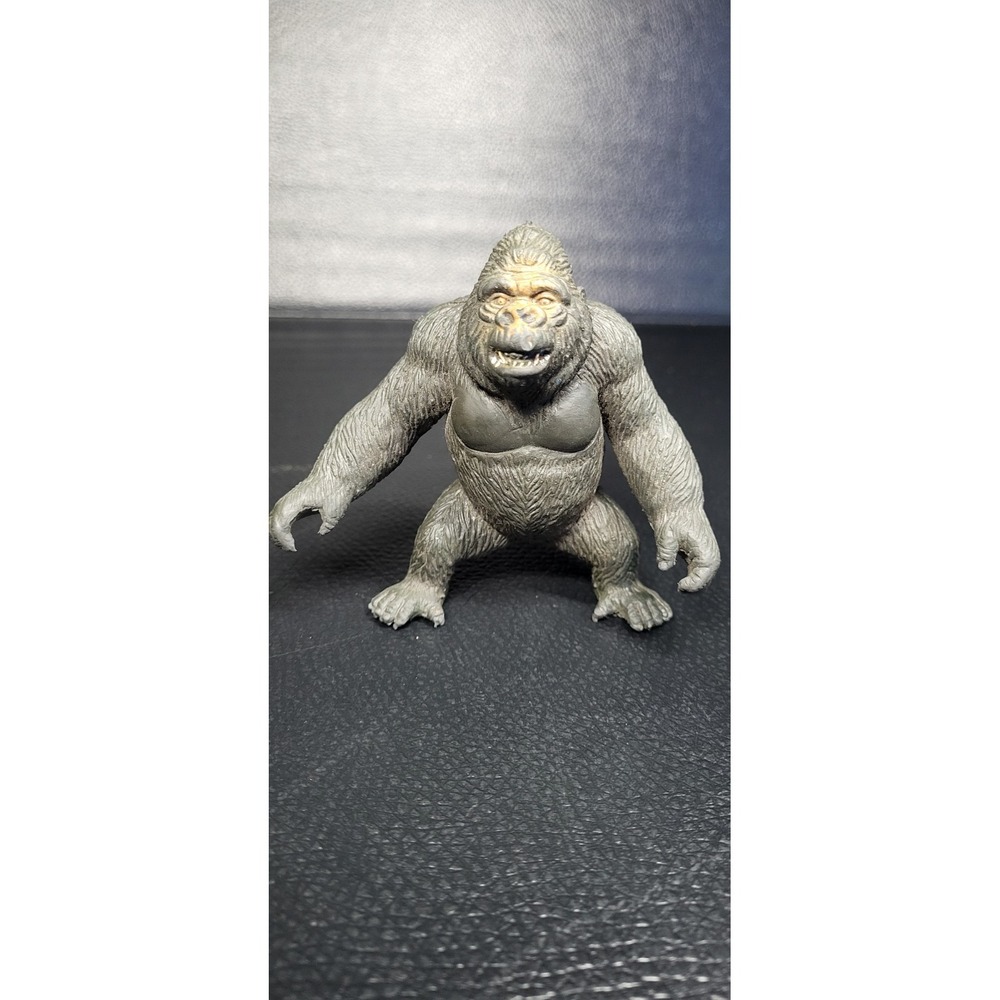 Vintage 1990s AAA gorilla with red eyes, solid rubber toy figure. Collectible